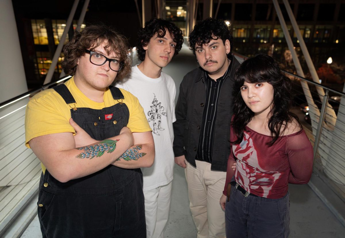 Psych-garage band Grocery Bag pose for a portrait on the Moody Pedestrian Bridge on Feb. 18. Grocery Bag will be an official artist at SXSW this year.
