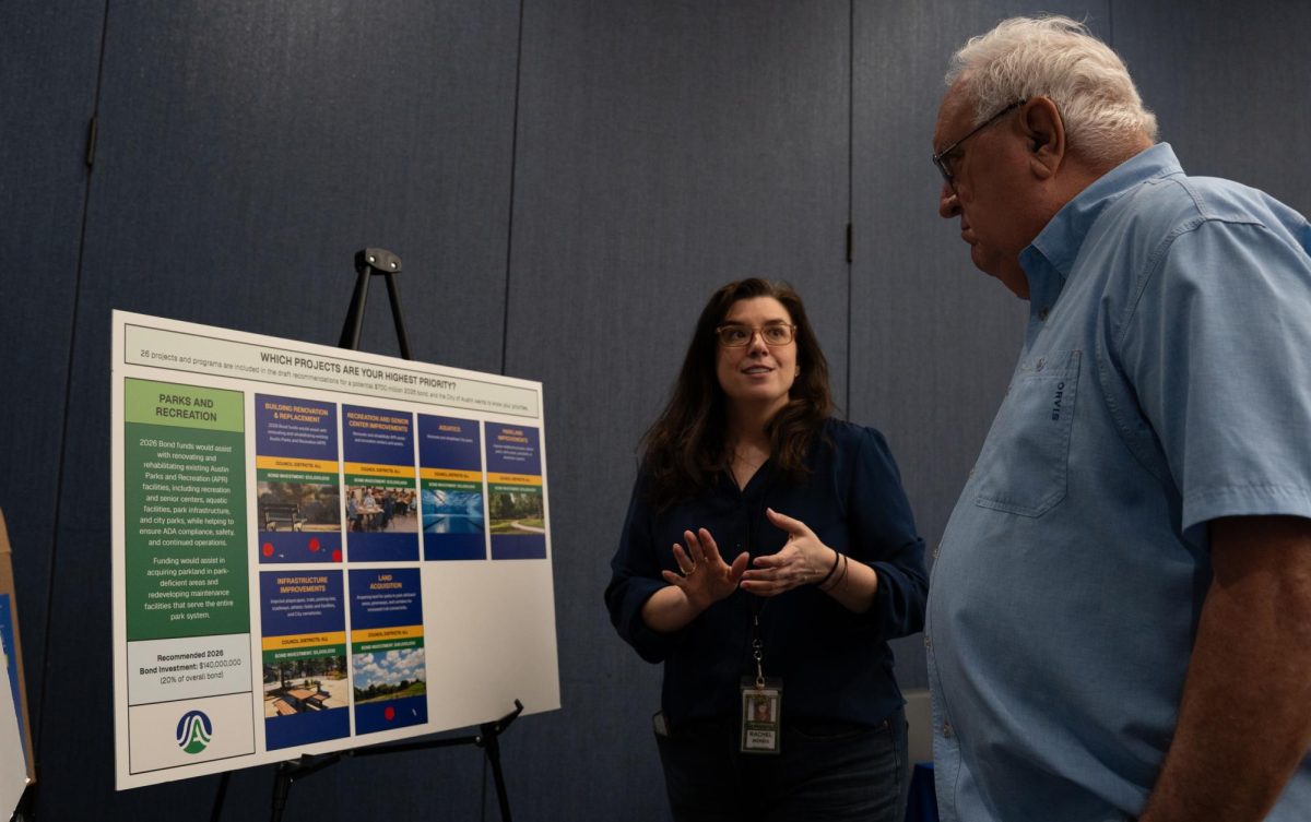 From left, Rachel Morris, Capital Improvement Program Manager for Austin Parks and Recreation, speaks to Clarence Haynie during the Bond 2026 Open House at the Permitting and Development Center on Feb. 25. 