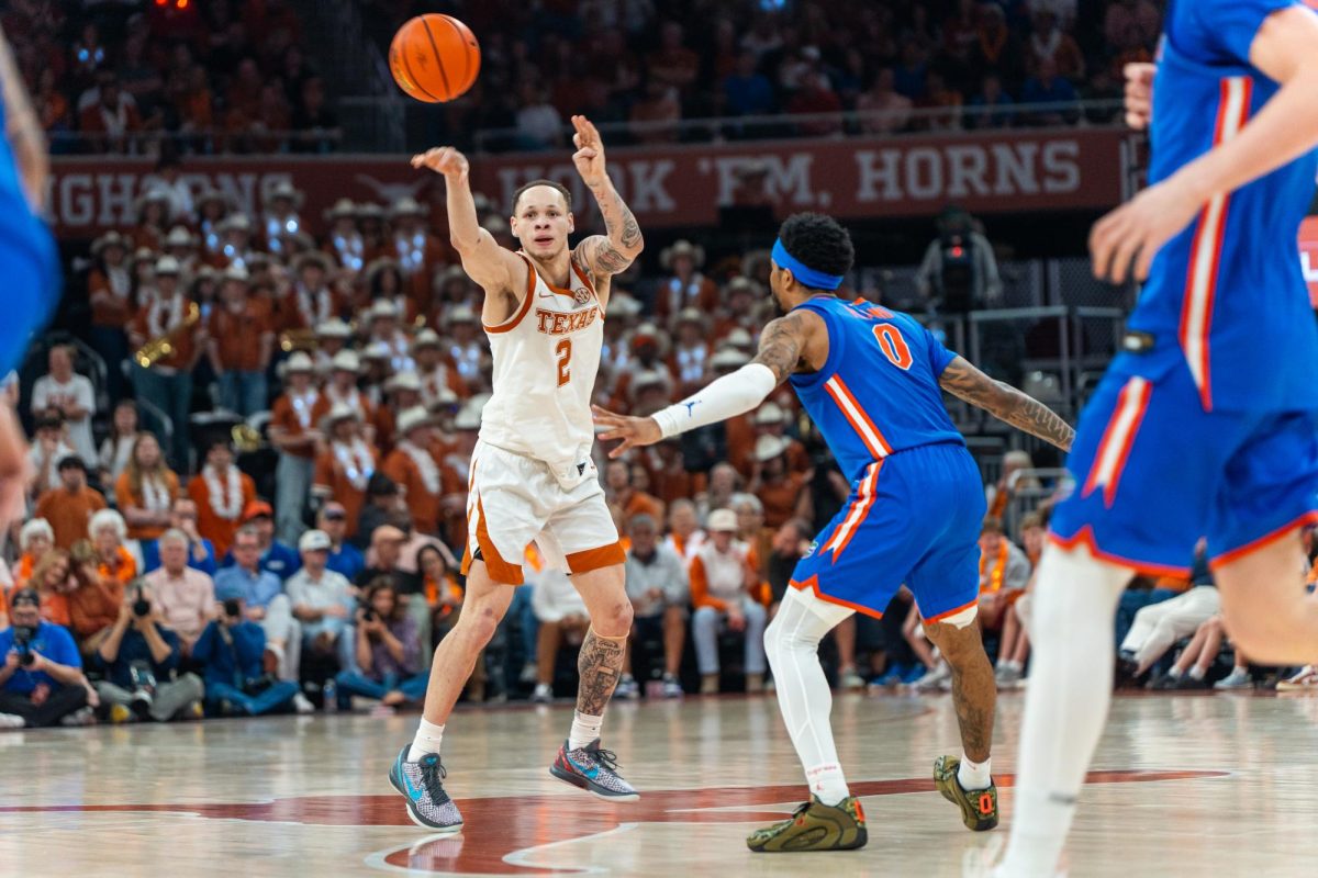 Senior guard Chendall Weaver passes the ball during Texas' game against Florida at the Moody Center on Feb. 25.