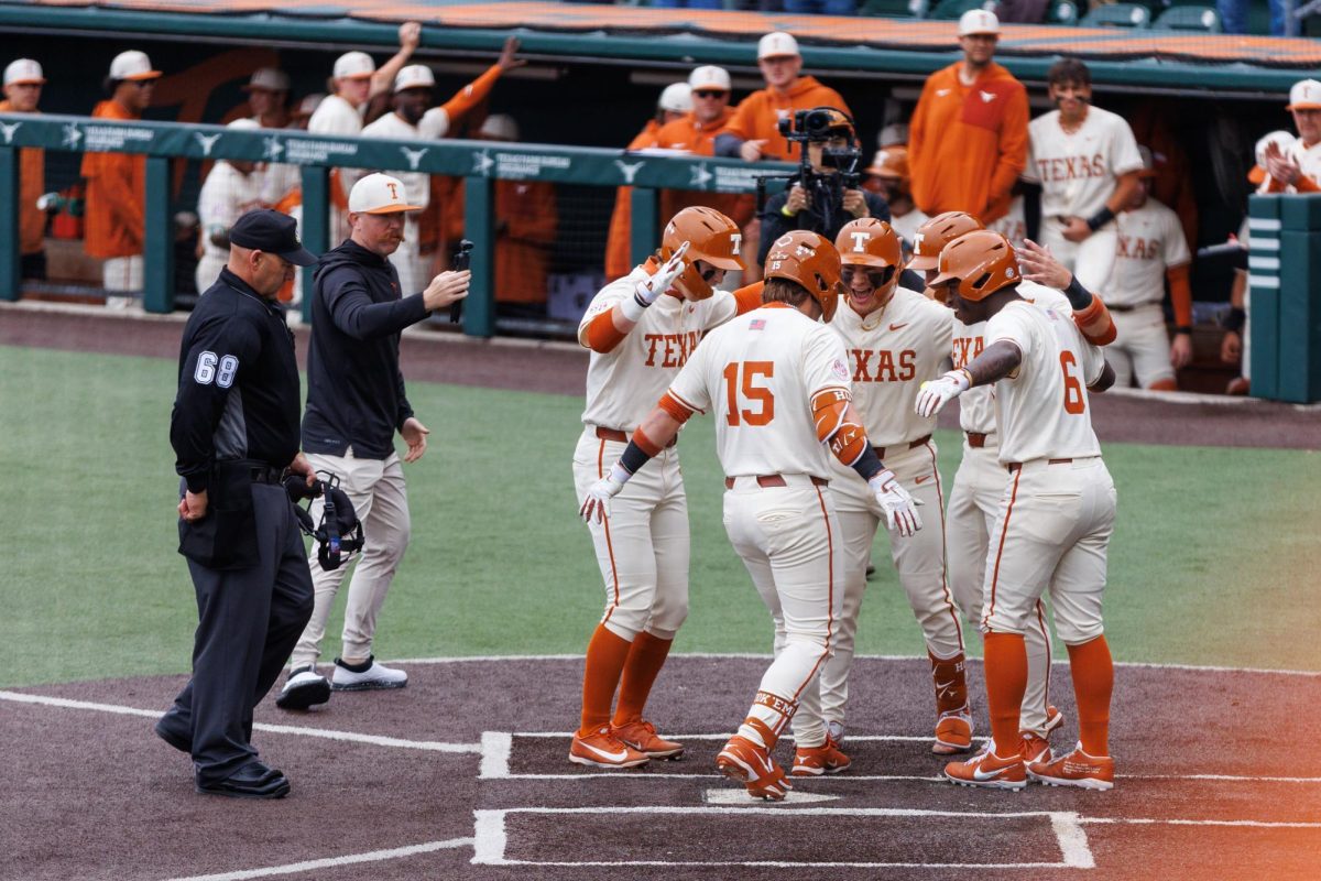 Graduate infielder Josh Livingston celebrates after hitting a grand slam at Texas' game against USC Upstate at Disch-Falk Field on March 8. Livingston hit a grand slam in the sixth inning and a two-run homer in the eighth to end the game via the 10-run mercy rule.