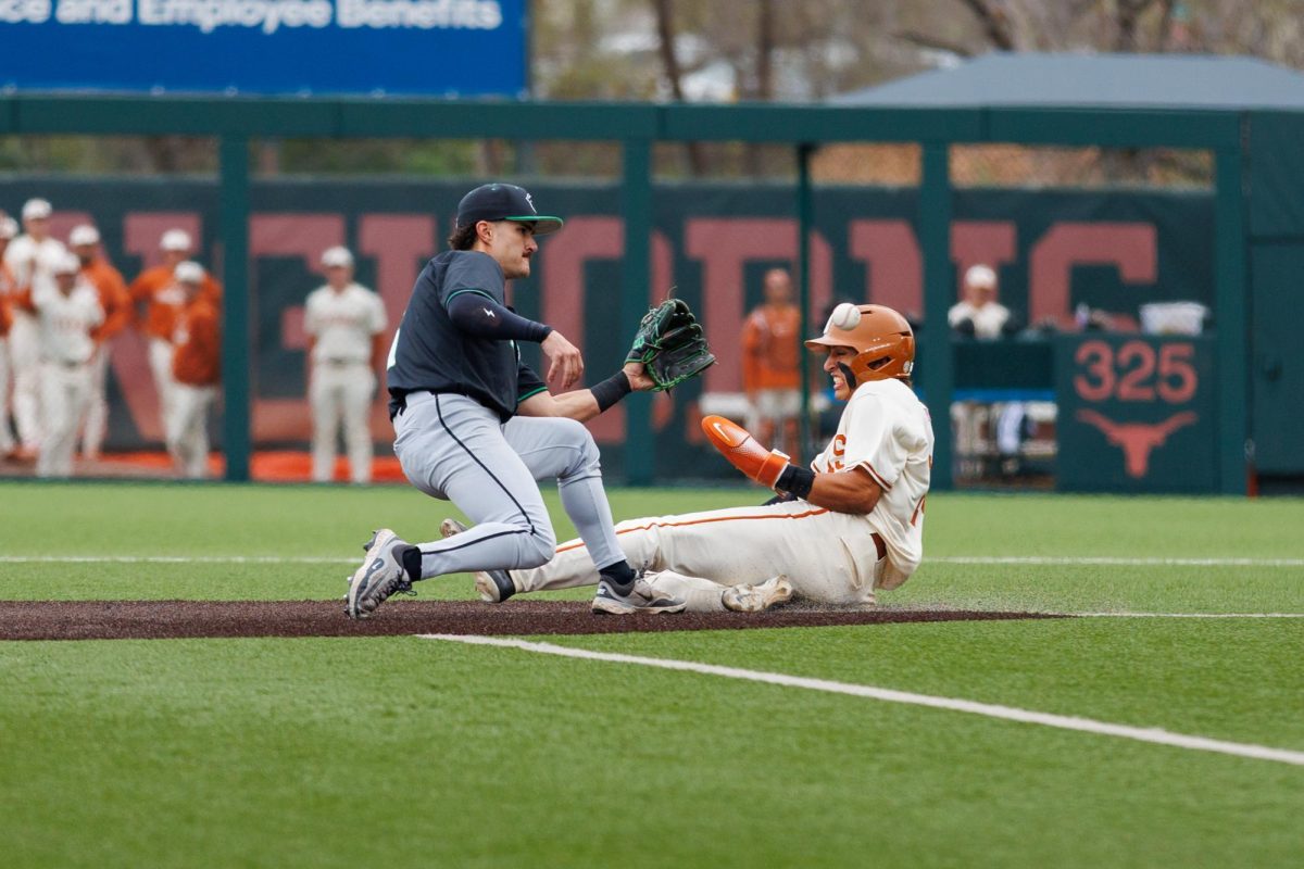 Sophomore infielder Adrian Rodriguez slides into second base at Texas' game against USC Upstate at Disch-Falk Field on March 8.