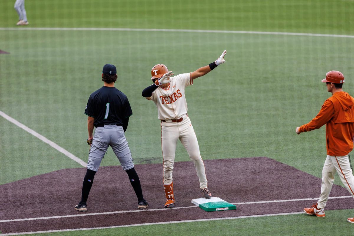 Sophomore infielder Adrian Rodriguez dabs on USC Upstate senior utility Wylie Waters at Texas' game at Disch-Falk Field on March 8.
