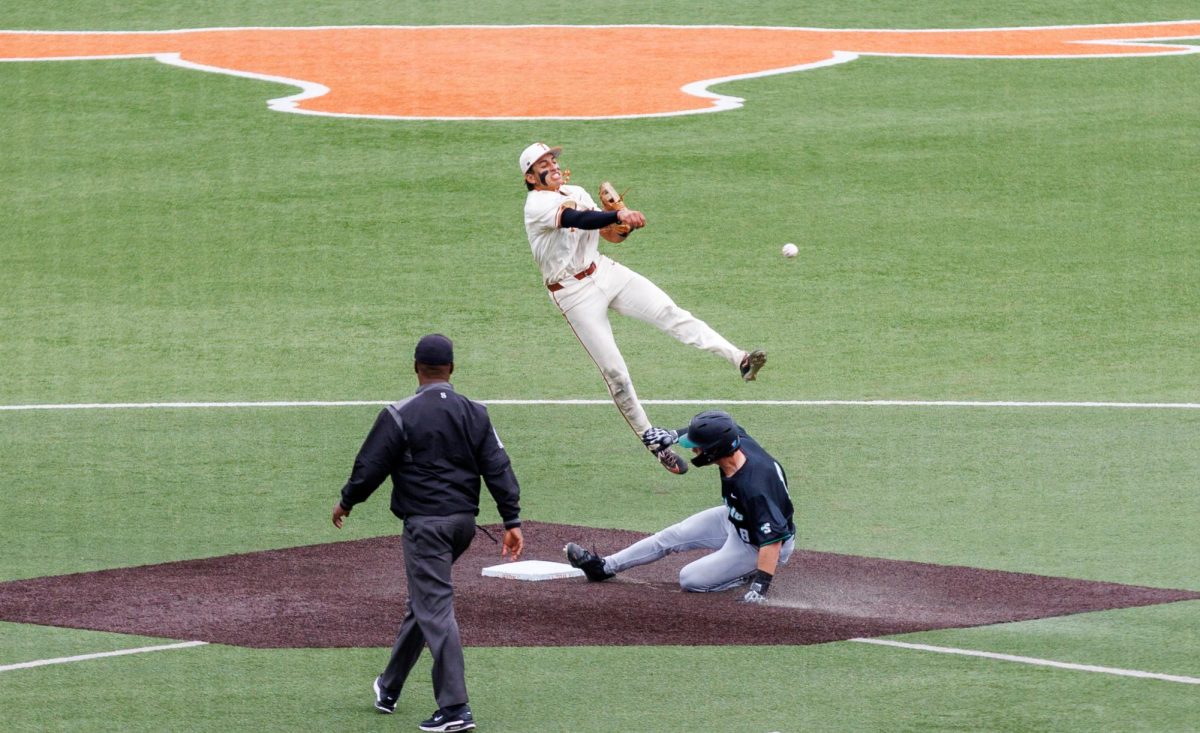 Sophomore infielder Adrian Rodriguez throws the ball to first at Texas' game against USC Upstate at Disch-Falk Field on March 8.