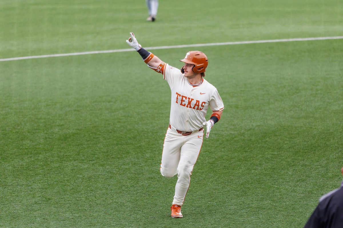 Graduate infielder Josh Livingston celebrates after hitting a grand slam at Texas' game against USC Upstate at Disch-Falk Field on March 8. Livingston hit a grand slam in the sixth inning and a two-run homer in the eighth to end the game via the 10-run mercy rule.