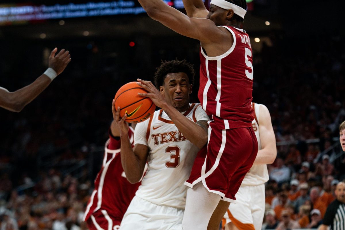 Oklahoma center Mohamed Wague guards Texas forward Dailyn Swain during a game in Austin, Texas on Saturday, March 7, 2026.  
