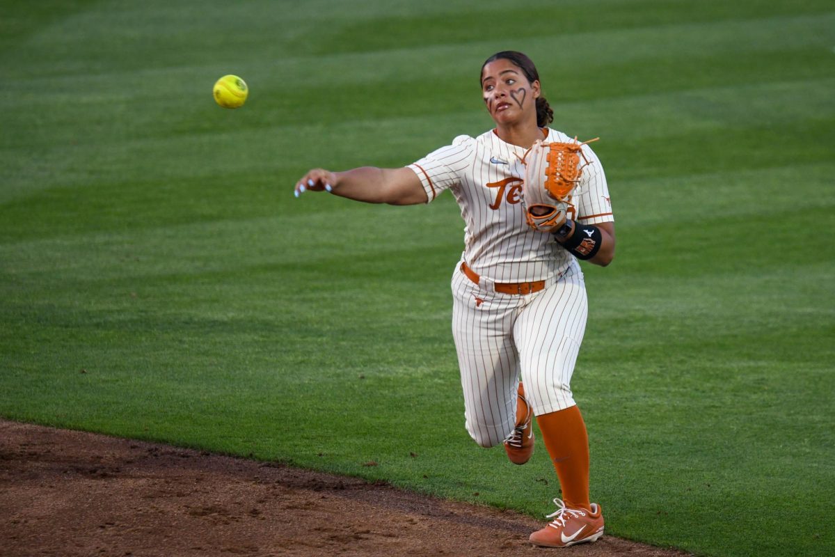 Freshman infielder MaTaia Lawson warms up before East Texas A&M takes their first at bat on March. 11.