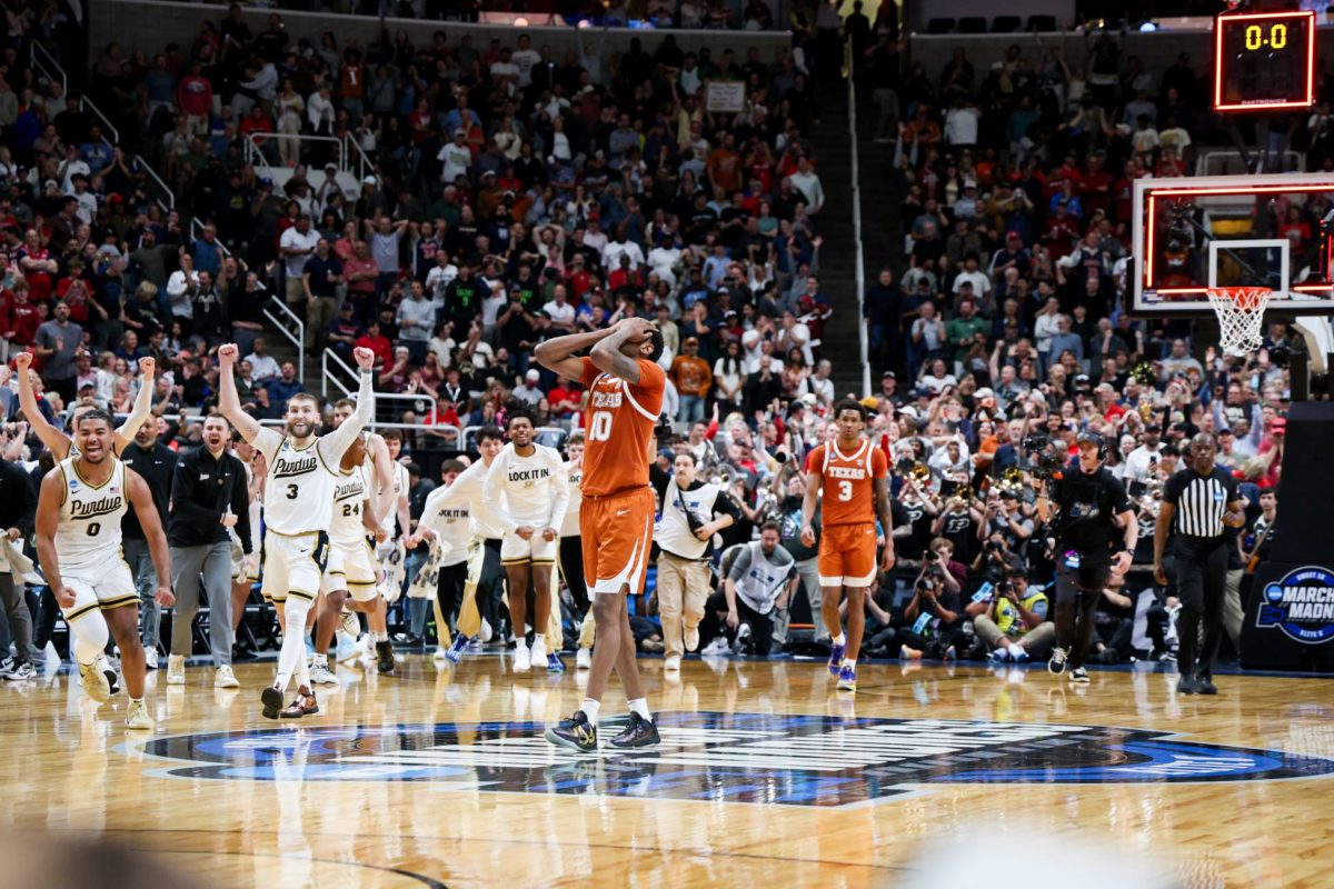 Forward Nic Codie clasps his hands on his face after the clock runs out during the Texas vs. Purdue Sweet 16 game at the SAP Center in San Jose, California, on March 26, 2026.