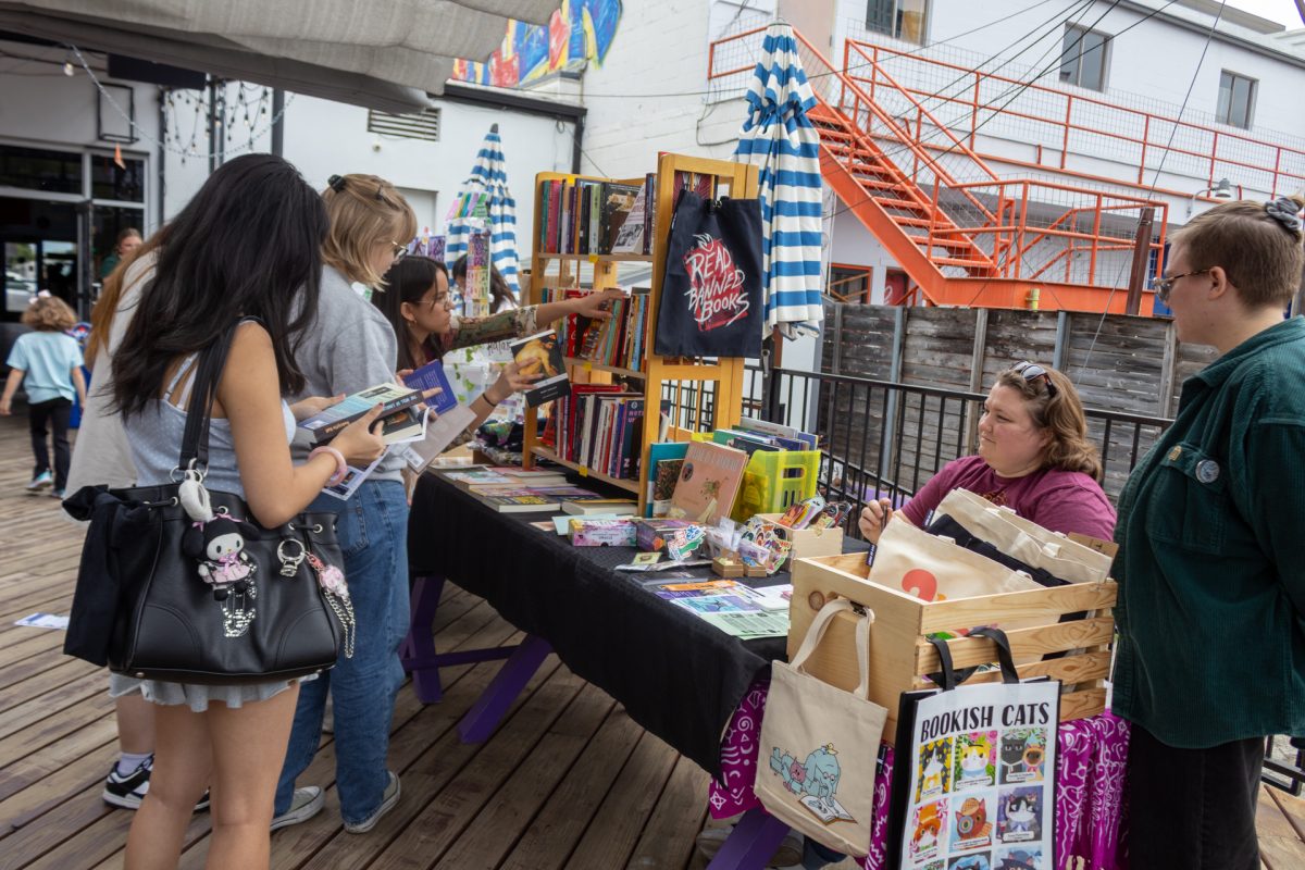 Attendees gather at the vendor fair at the "Where Did All the Books Go?" event at the 1972 Pub on March 28.