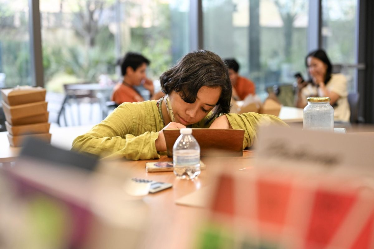 Editorial assistant Sophia Ordaz with the University of Texas Press sells comics and books about gaming, animation and multimedia at the BIPOC PoP Expo and Symposium on March 7. The event took place in the Glickman Conference Center in Patton Hall and ran from March 5-7. 