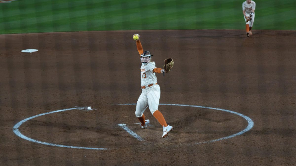 Freshman pitcher Hannah Wells pitches during Texas' game Abilene Christian University on Feb. 12.