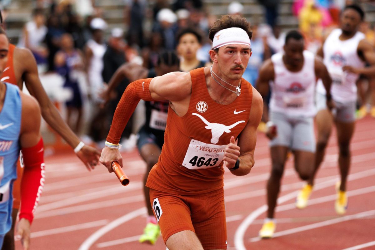 Senior John Rutledge runs the mens 4x400 relay on April 4, 2026.