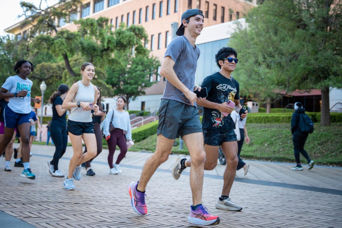 Senior Cameron Pratt leads a run for the Texas Run Club on Speedway on March 26, 2026.