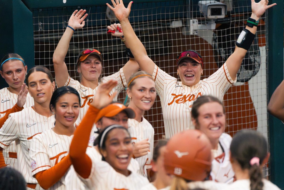 Texas celebrates after right-handed pitcher Hannah Wells hit a home run during Texas' final game against Oklahoma on April 12.