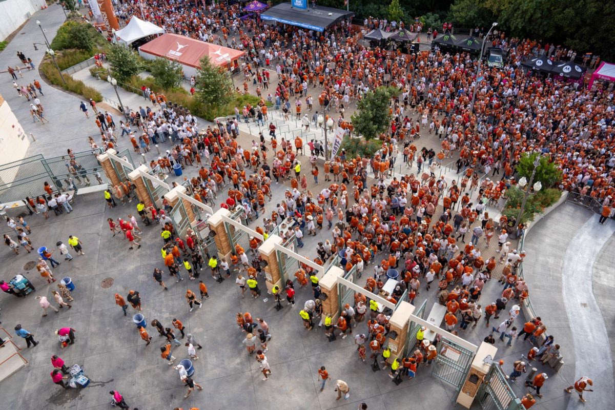 Fans enter Gate 1 at Darrell K Royal Stadium ahead of Texas' game against Georgia on Oct. 19, 2024. 