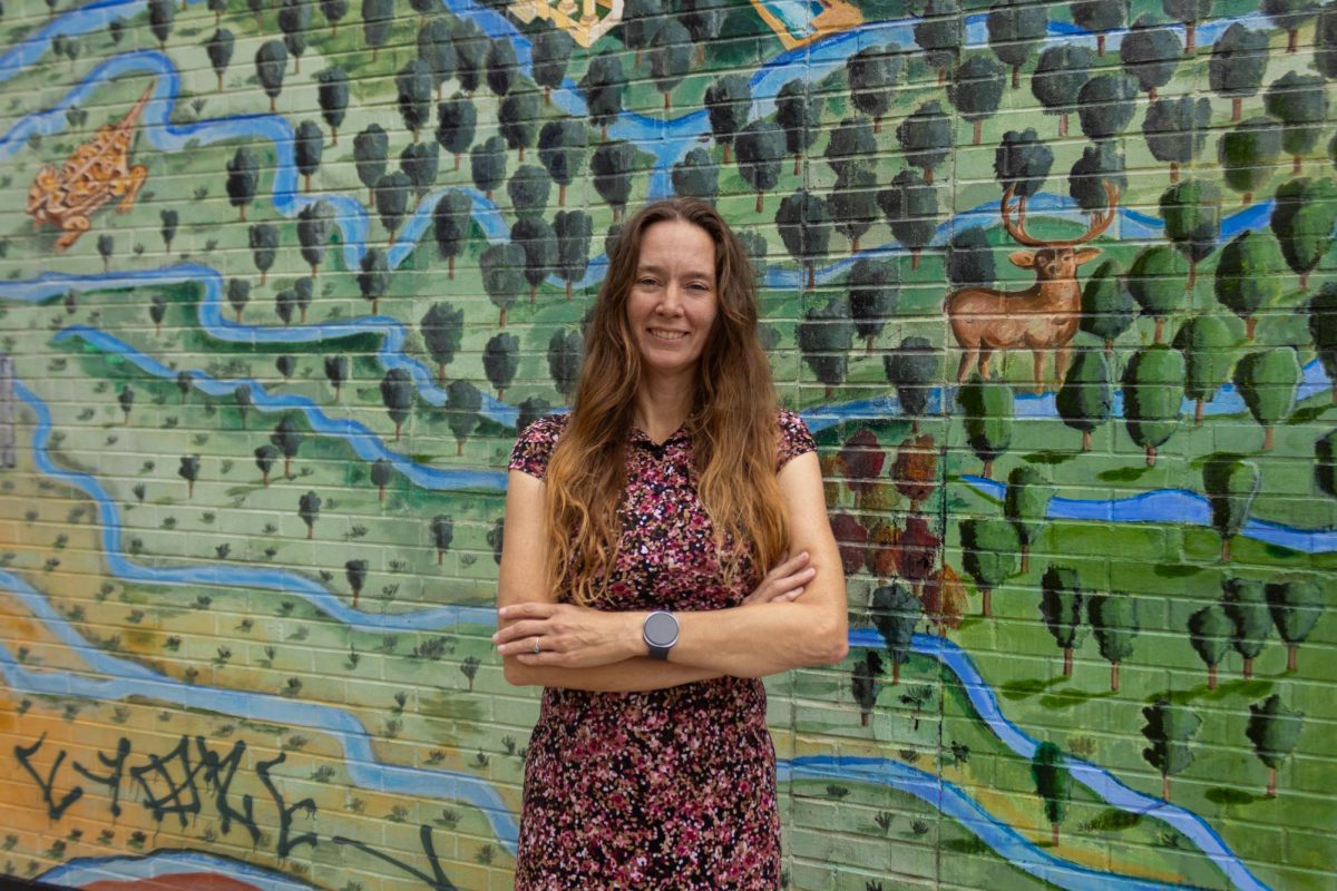 District 9 candidate, Katie Kam, poses for a portrait in front of Austintatious Mural on April 3.