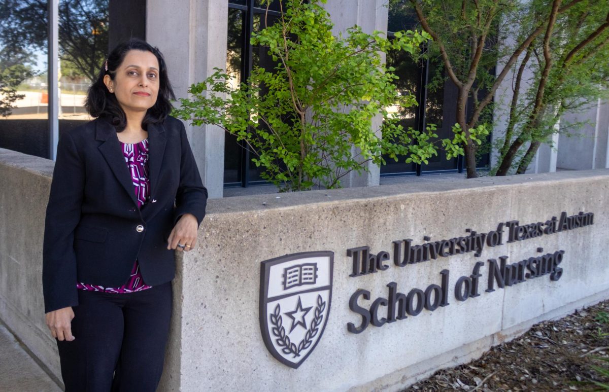 Dr. Kavita Radhakrishnan, School of Nursing Interim Dean, poses for a portrait in front of the School of Nursing on April. 6.