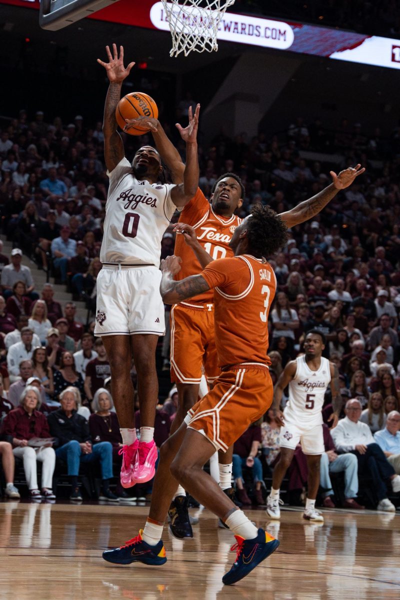 Texas forward Nic Codie (#10) blocks a layup by Texas A&M guard Marcus Hill (#0) during a game in College Station, Texas, on Saturday, Feb. 28.