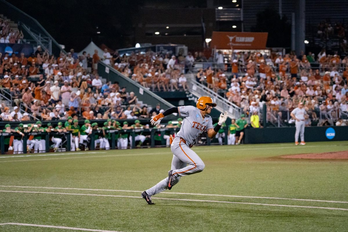 Sophomore infielder Adrian Rodriguez runs the bases after hitting the game winning double during Game 2 of the Austin Super Regional against Oregon on Sunday, June 7 at UFCU Disch-Falk Field.