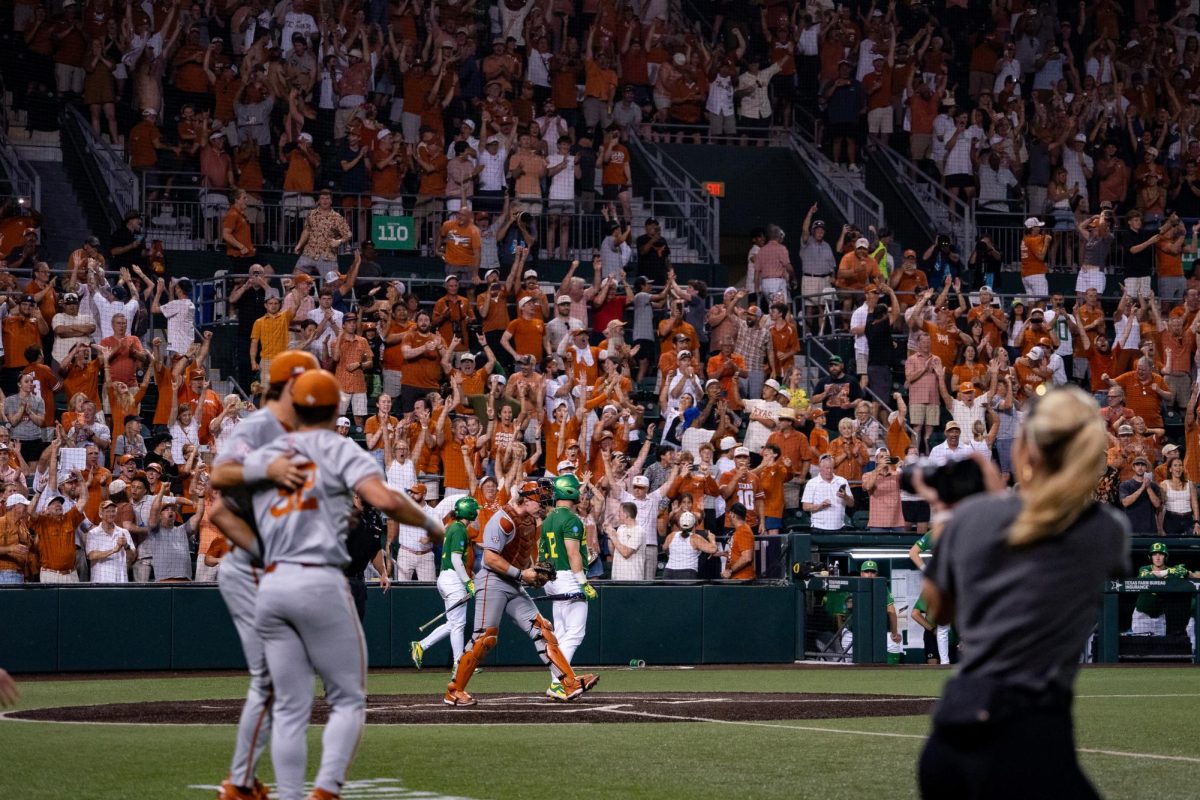 Texas fans and players celebrate as the final strike was thrown during Game 2 of the Austin Super Regional against Oregon on Sunday, June 7 at UFCU Disch-Falk Field. The Texas Longhorns defeated the Oregon Ducks 6-5 to advance to the Men's College World Series in Omaha, Nebraska.