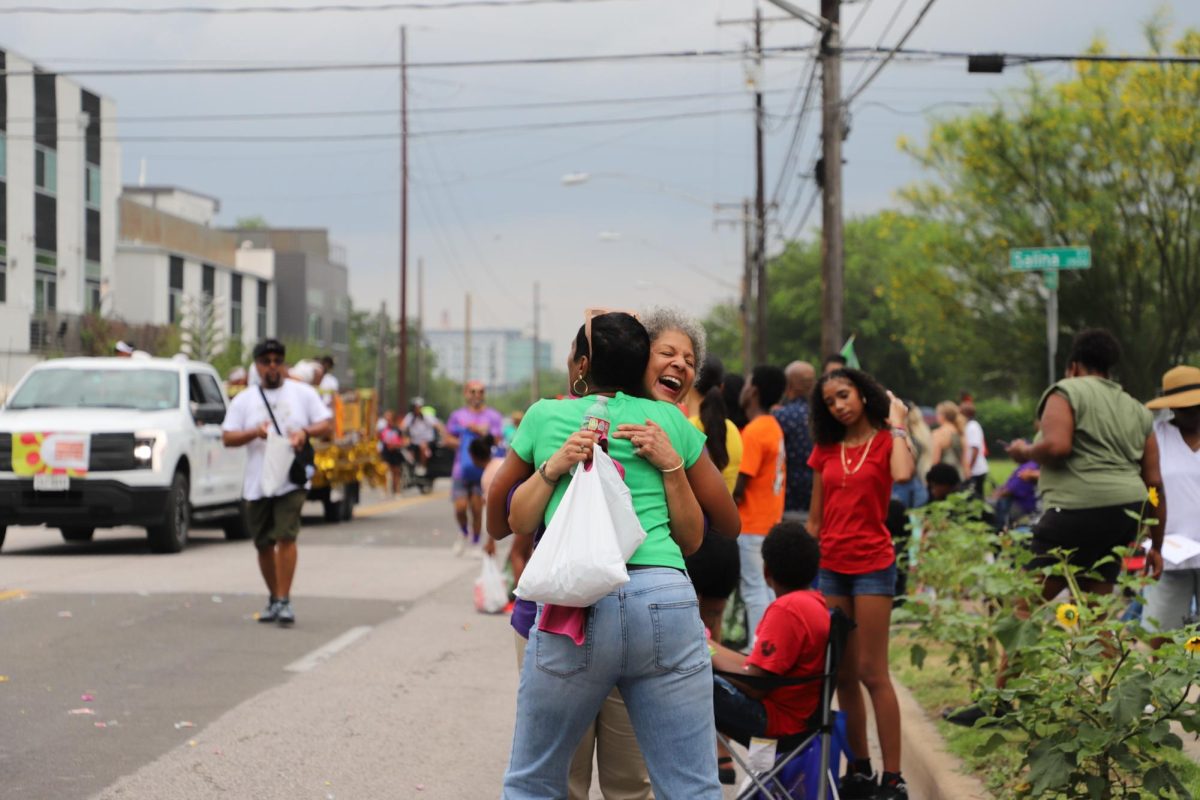 Two women embrace at the Central Texas Juneteenth Parade on Friday, June 19.