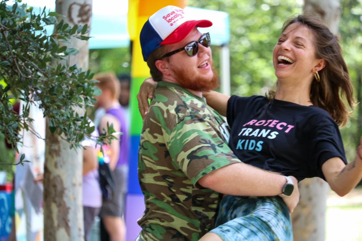 People dance to the pride picnic DJ set at Pease Park on June 27.
