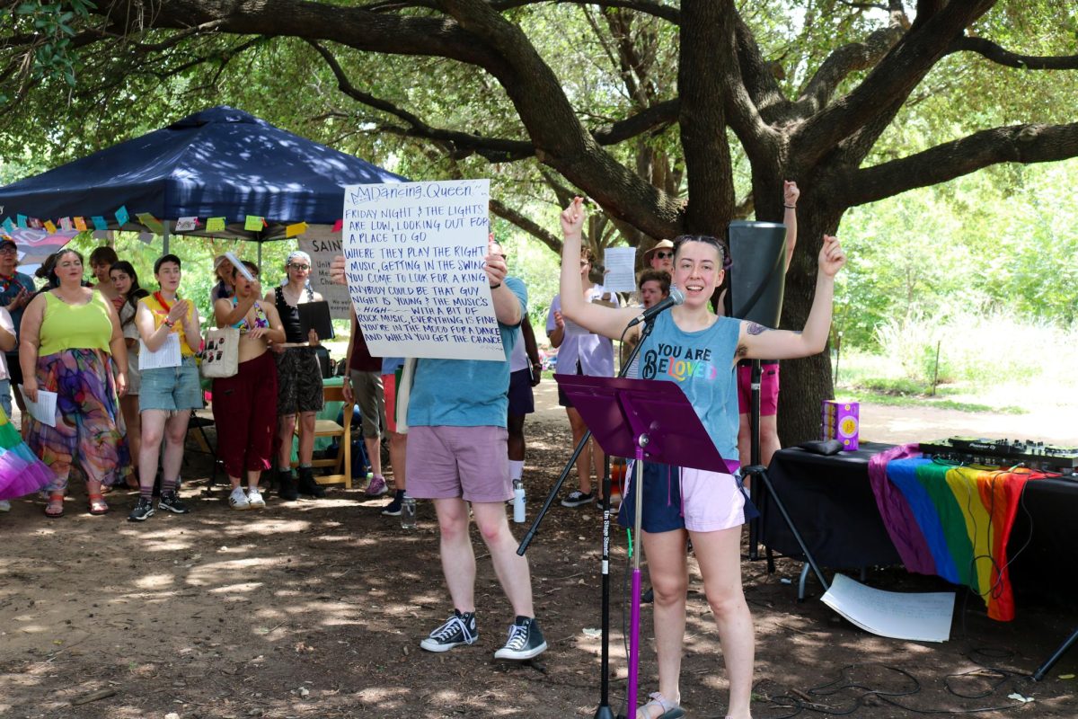 The queer choir sing-along performs Dancing Queen at the Pease Park pride picnic on June 27.