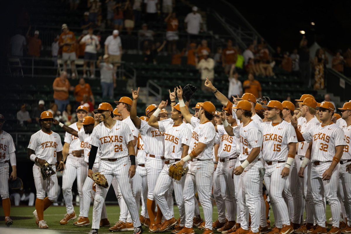 The Longhorns sing "The Eyes of Texas" to the crowd after their win against Missouri at Disch-Falk Field on May 15. The Longhorns won 11-6.