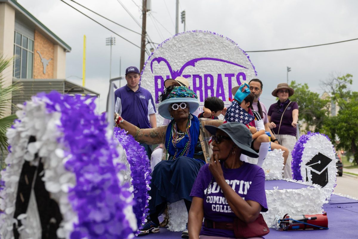 The Austin Community College Riverbats pass out candy as they process through the Central Texas Juneteenth Parade in East Austin on Friday, June 19.