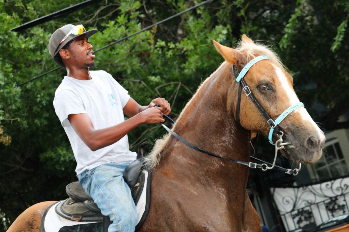 Horseback riders ride down the streets during the Central Texas Juneteenth Parade on Friday, June 19.