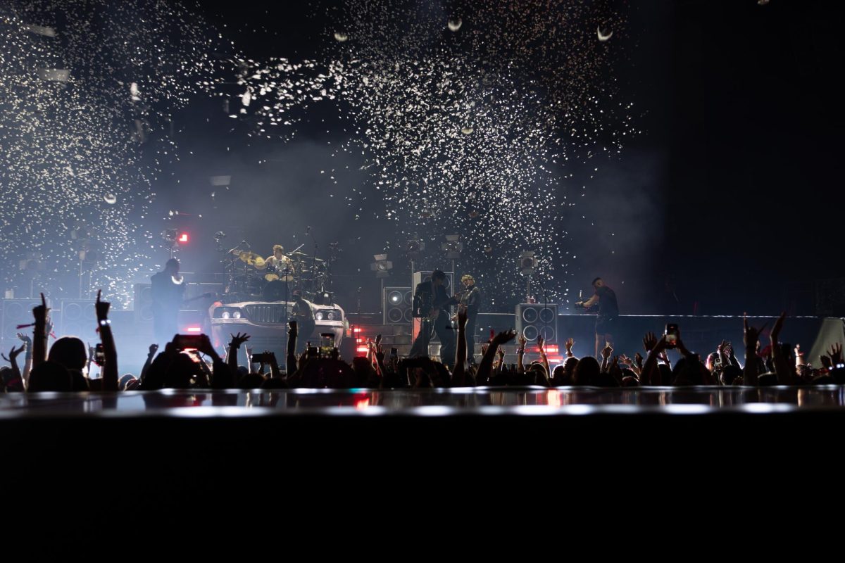 5 Seconds of Summer shoots confetti at the end of its first song of the night at Moody Center in Austin on June 21.