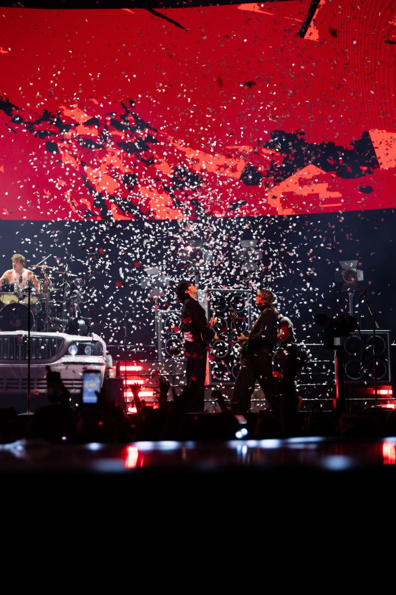 5 Seconds of Summer shoots confetti at the end of its first song of the night at Moody Center in Austin on June 21.