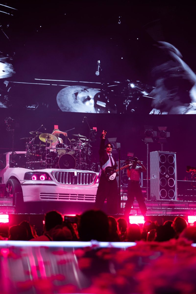 Hemmings sings and plays the guitar during the band's performance of "No. 1 Obsession" from its latest album, EVERYONE'S A STAR, in Austin on June 21.