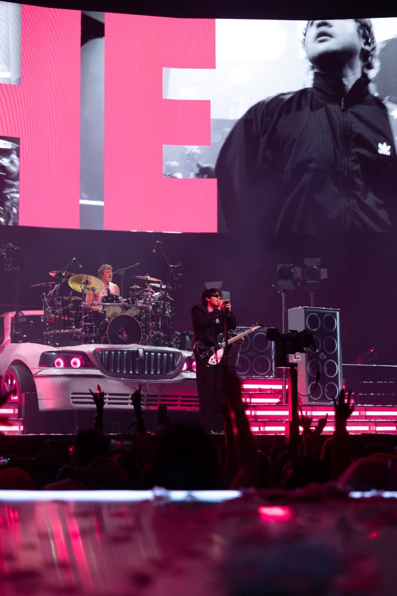 Hemmings sings and plays the guitar during the band's performance of "No. 1 Obsession" from its latest album, EVERYONE'S A STAR, in Austin on June 21.