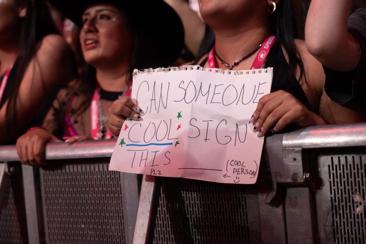 A fan holds up a sign at 5SOS's tour stop in Austin on June 21.