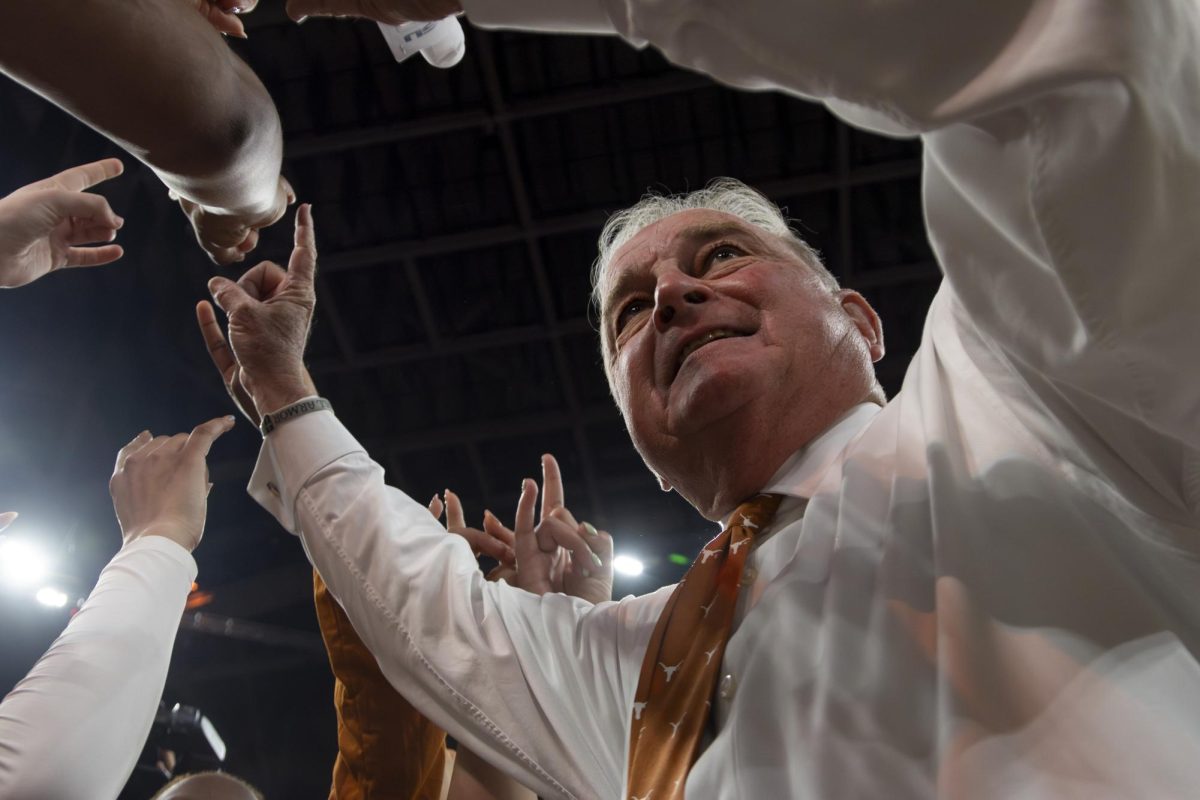 Head coach Vic Schaefer huddles with the team after a win against LSU on Feb. 5.