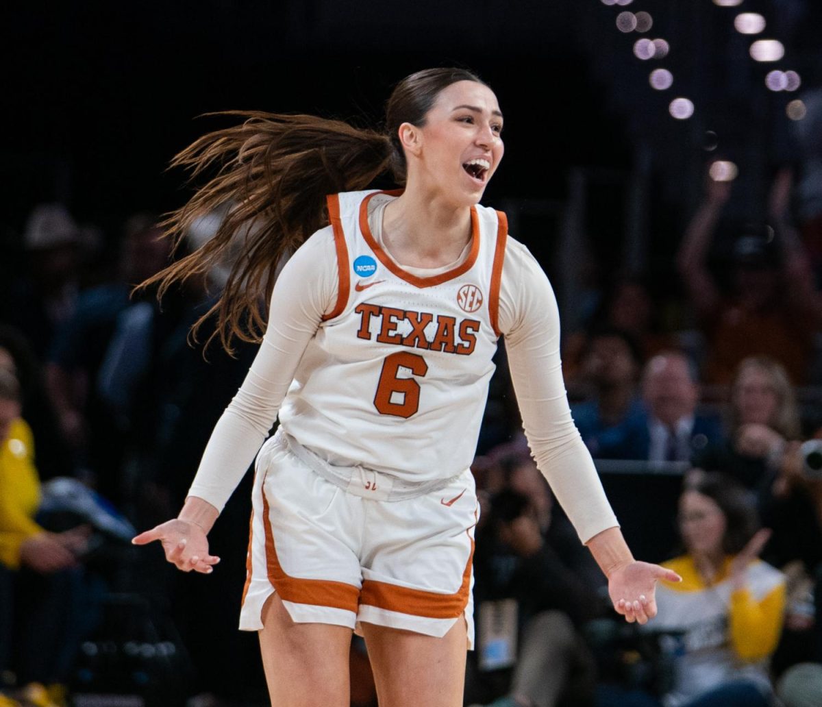 Senior Sarah Graves celebrates making a three point jump shot against the Michigan Wolverines during their elite eight matchup on March 30.