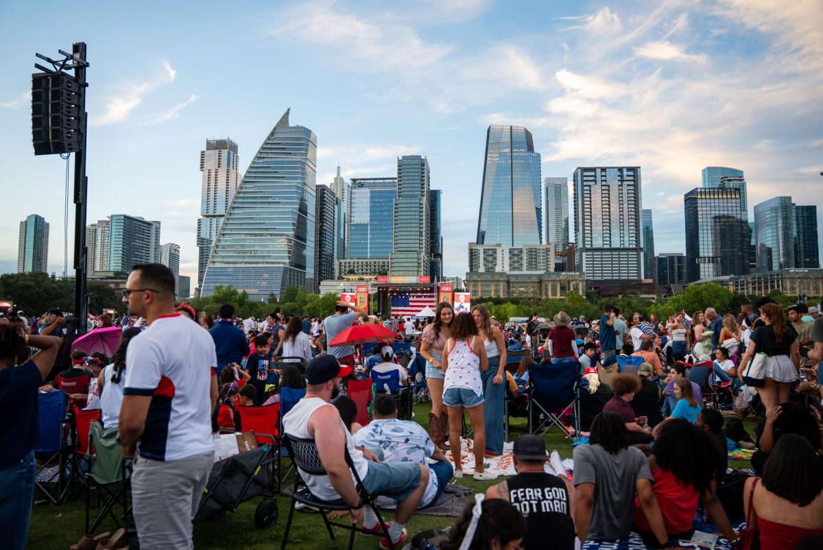 People walk through the Star Spangled Fest at Auditorium Shores in Austin, Texas, on July 4.