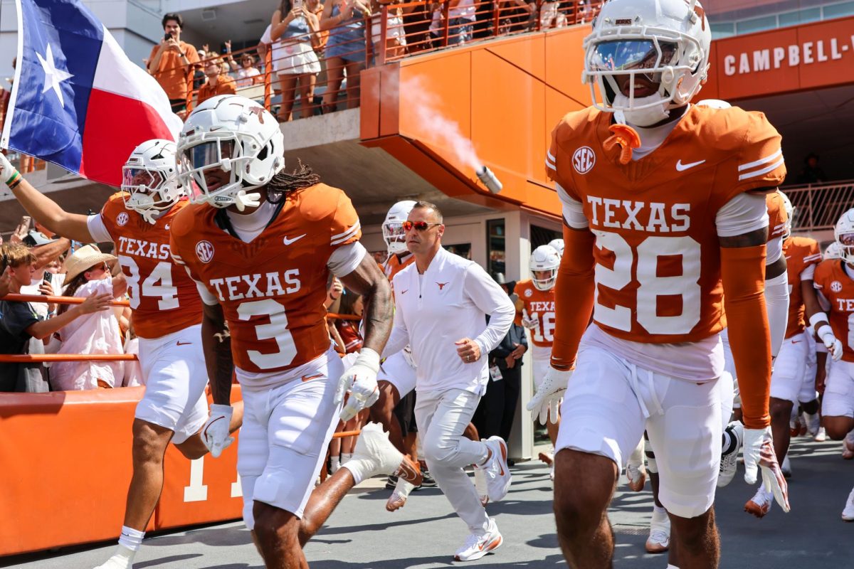Head coach Steve Sarkisian run out of the tunnel at Darrell K. Royal Texas Memorial Stadium ahead of the game against UT El Paso on Sept. 13, 2025. 