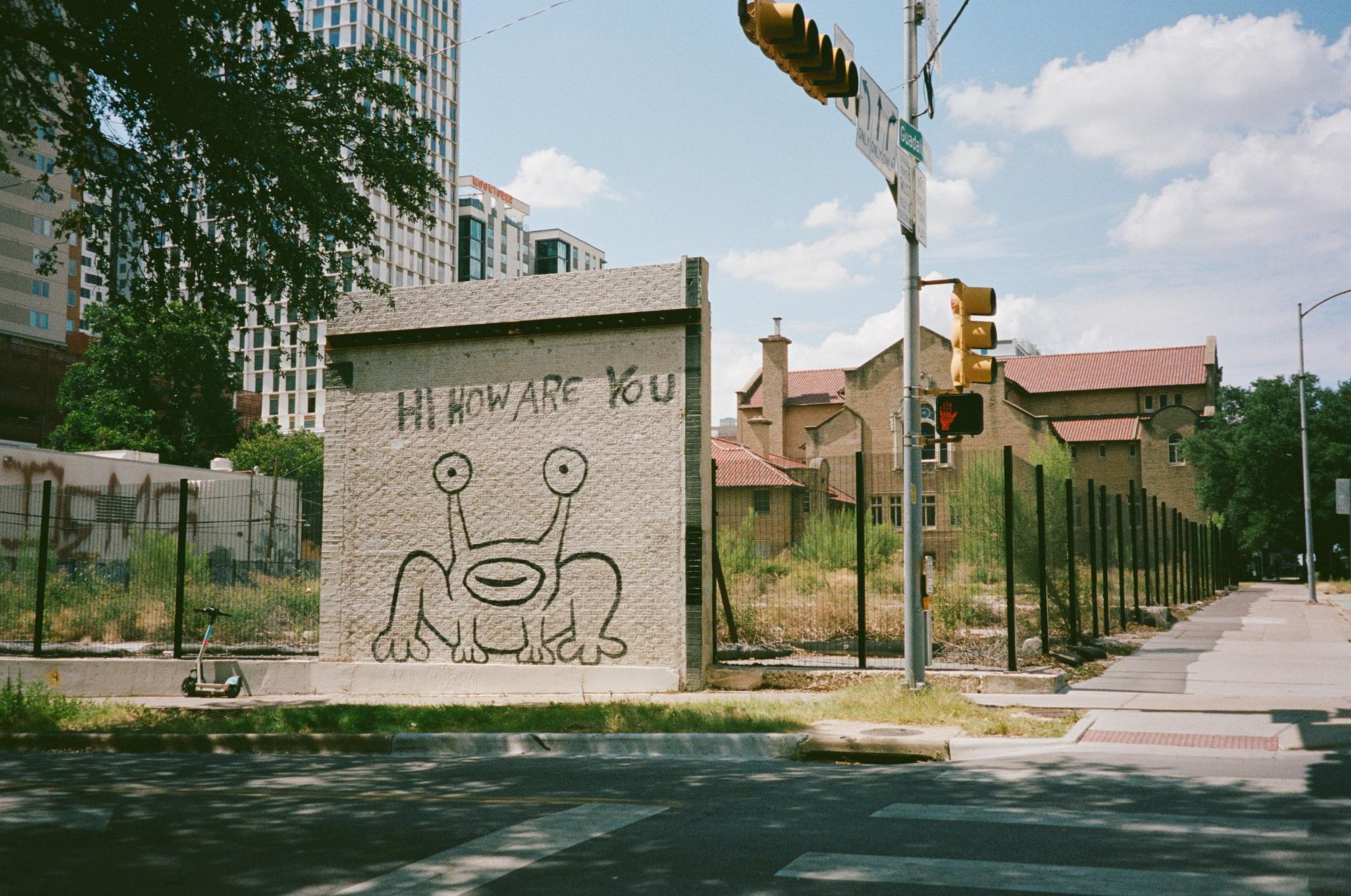 The "Hi, How Are You" mural is pictured on Monday, July 6. The wall was previously part of Sound Exchange, an independent record store and live music venue that closed in the early 2000s. 